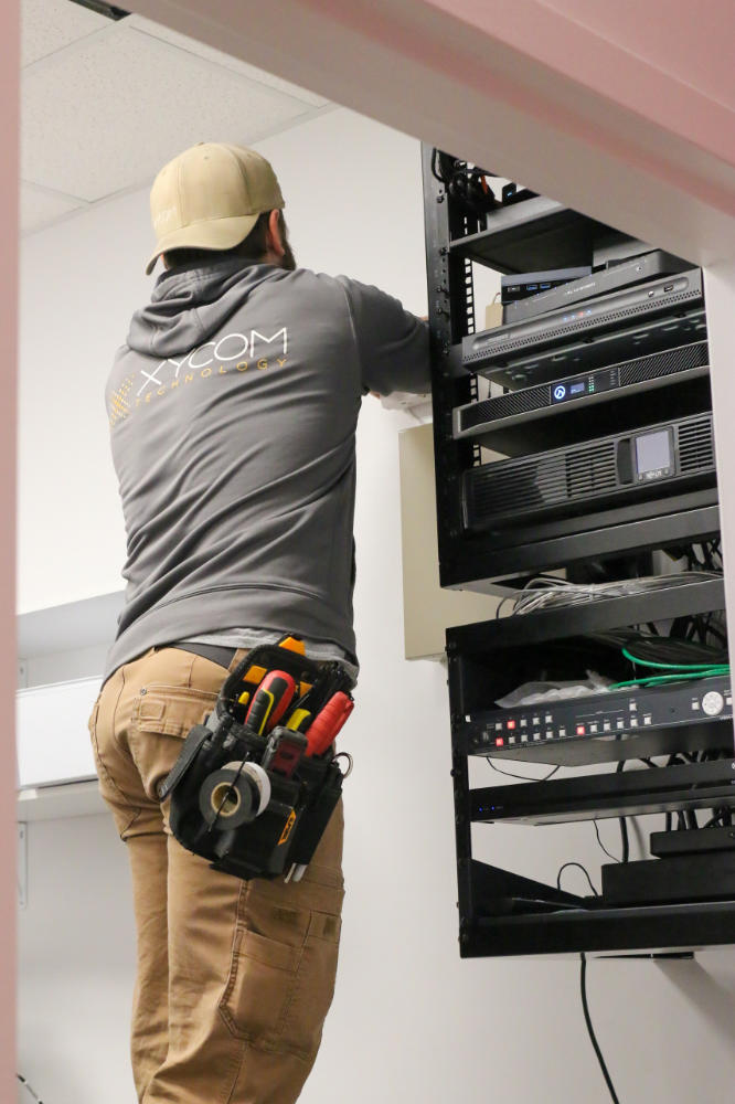 Xycom technician installing equipment